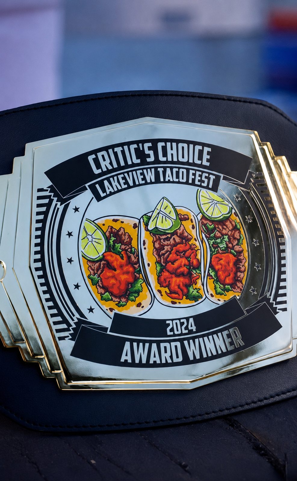The Critic's Choice Lakeview Taco Fest 2024 Award Winner belt, three arrachera tacos engraved on the gold plate